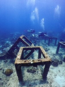 Underwater scene with rusted structures.